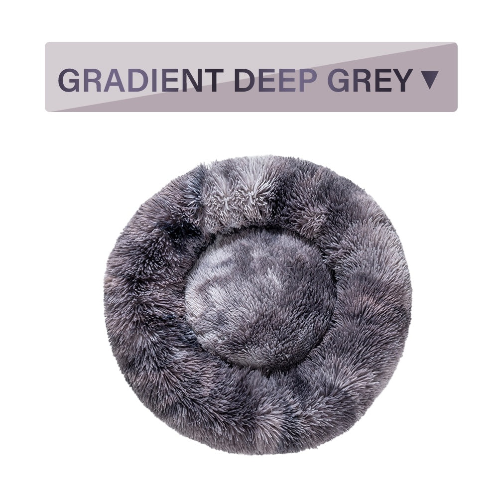 Soft, fluffy donut dog bed by Tangled Trails Outdoor Gear featuring warm, long plush cushioning for pets.