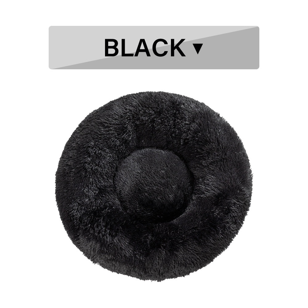 Soft, fluffy donut dog bed by Tangled Trails Outdoor Gear featuring warm, long plush cushion for cozy pet comfort.