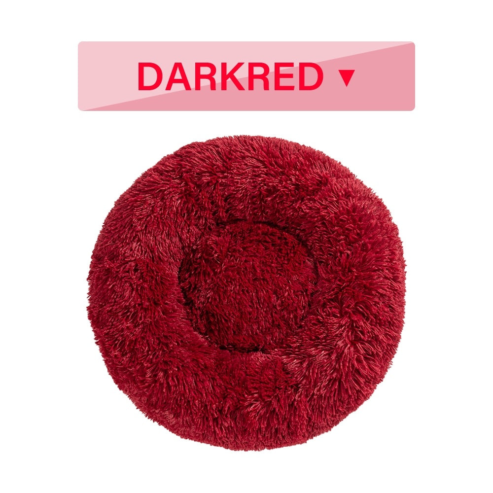 Soft, fluffy donut dog bed by Tangled Trails Outdoor Gear featuring warm, long plush cushion for cozy pet comfort.