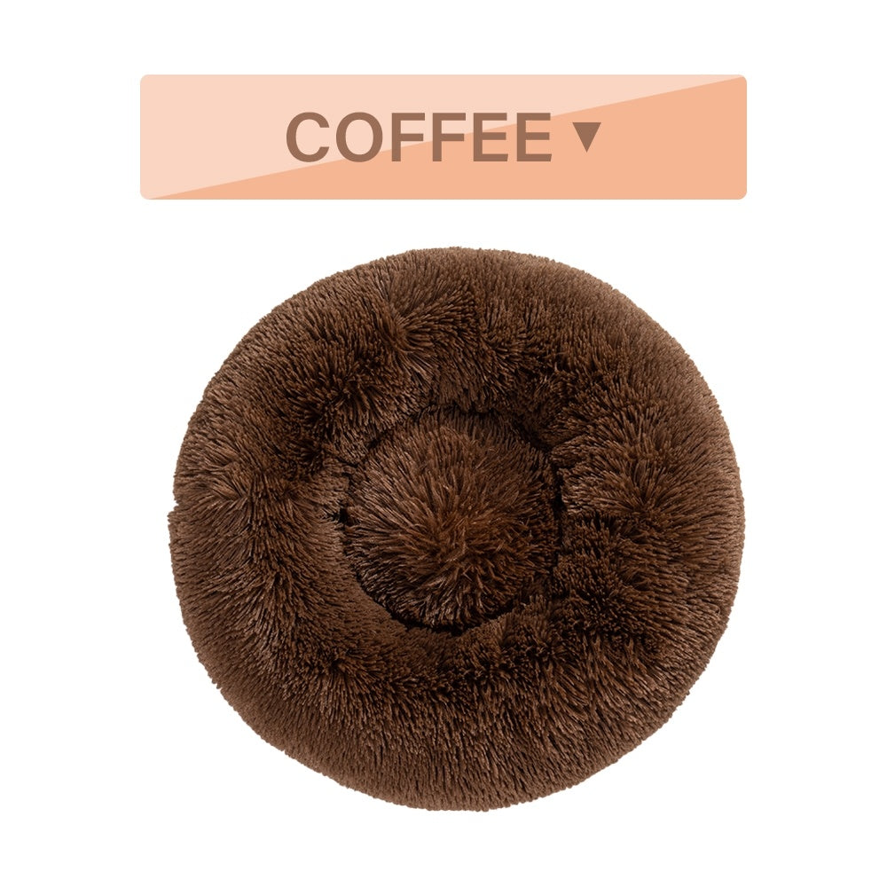 Soft, fluffy donut dog bed by Tangled Trails Outdoor Gear with warm, plush fabric and cozy cushioning for pets.