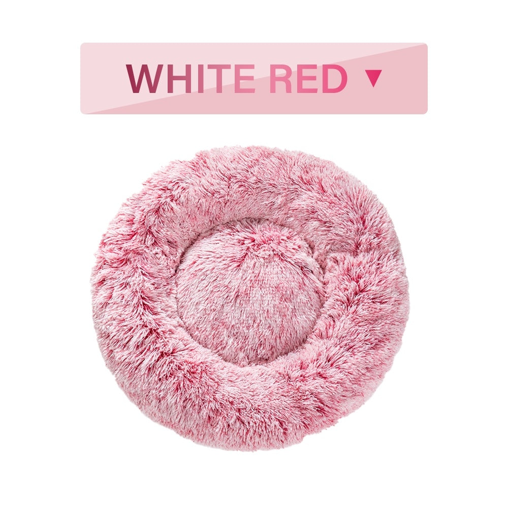 Soft, fluffy donut dog bed by Tangled Trails Outdoor Gear with warm, long plush pet cushion for cozy comfort.