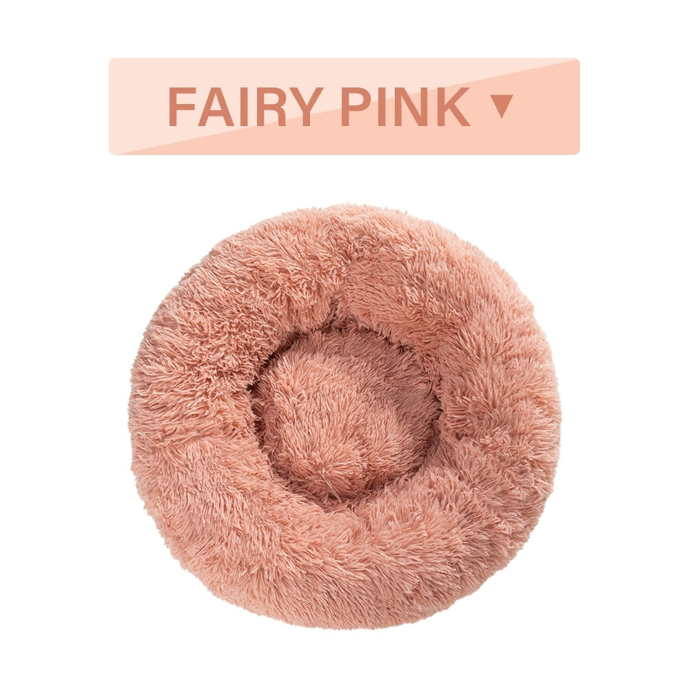 Soft, fluffy donut dog bed by Tangled Trails Outdoor Gear featuring warm, plush long fabric for cozy pet comfort.